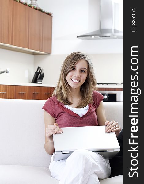 Relaxed young woman closing a laptop. Relaxed young woman closing a laptop.