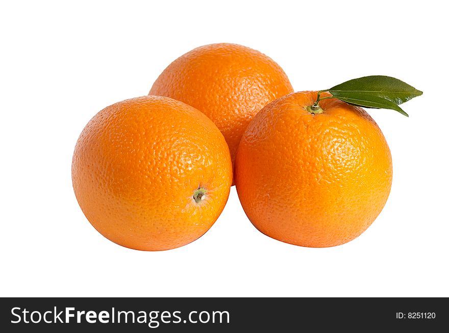 Ripe oranges and green leaves isolated on a white background. Ripe oranges and green leaves isolated on a white background.