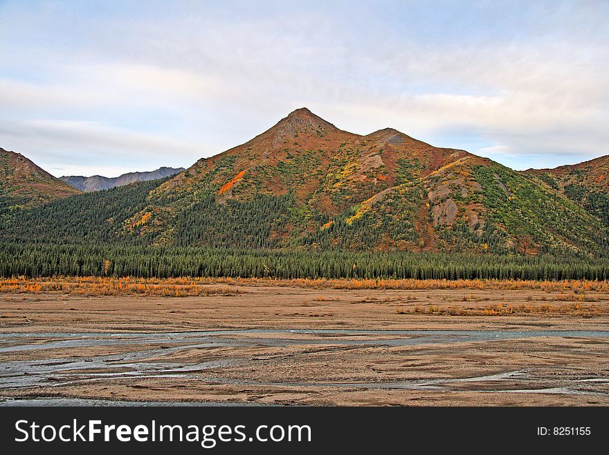 Glacier bed in Alaska with running water.