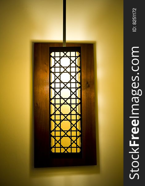 A decorative lamp shade in a luxurious hotel room.