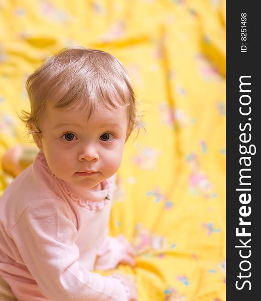 Little girl on yellow background - shallow DOF