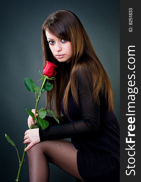 Young girl with rose, studio shot