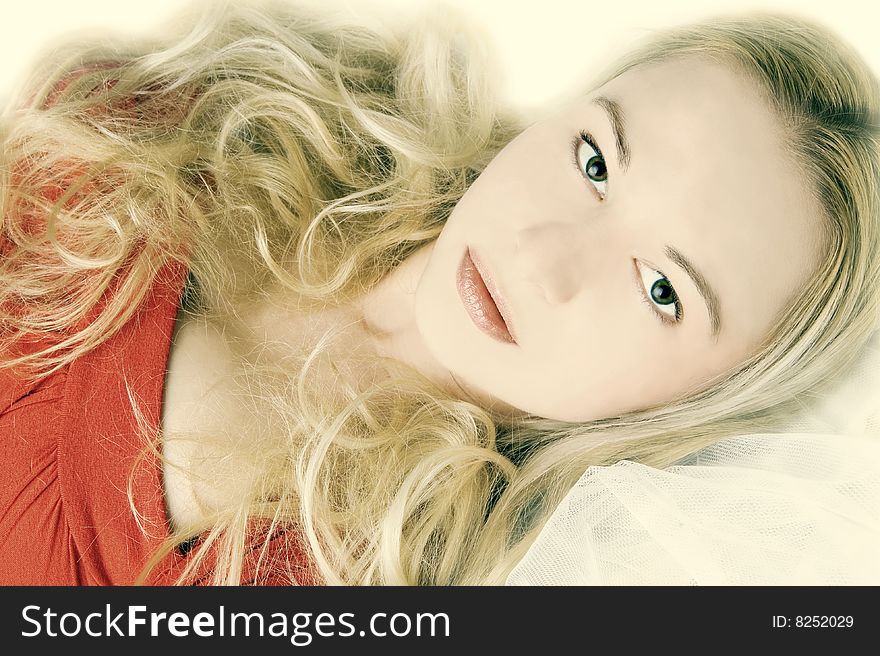 Sensual female with long blond hair  lying in bed. Sensual female with long blond hair  lying in bed