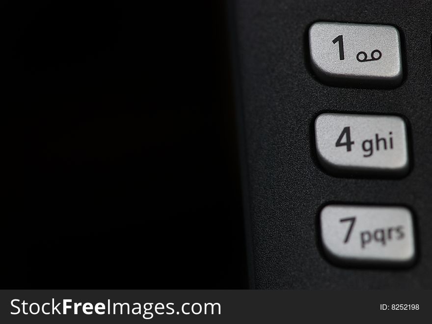 Phone keyboard closeup on dark background
