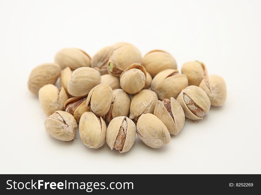 Isolated pistachios on white background