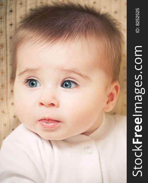 Portrait of adorable blue-eyes baby. Face close-up