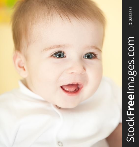 Portrait of adorable happy blue-eyes baby. Face close-up. Portrait of adorable happy blue-eyes baby. Face close-up