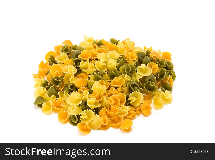 Mixed colored pasta on the white bachground