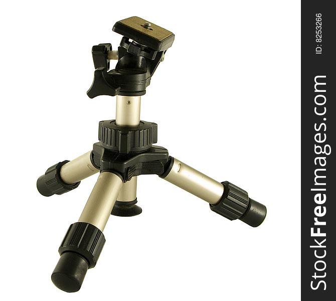 A photographers mini tripod isolated over a white background. A photographers mini tripod isolated over a white background