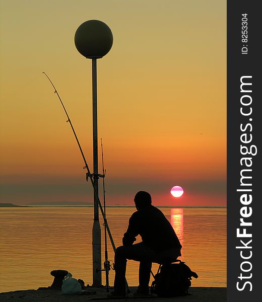 A fisherman by the sunset