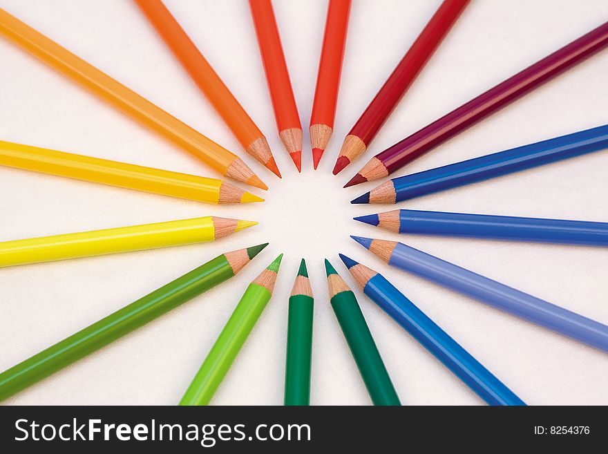 Artists' Graphic colour pencils forming circle on Canvas. Artists' Graphic colour pencils forming circle on Canvas