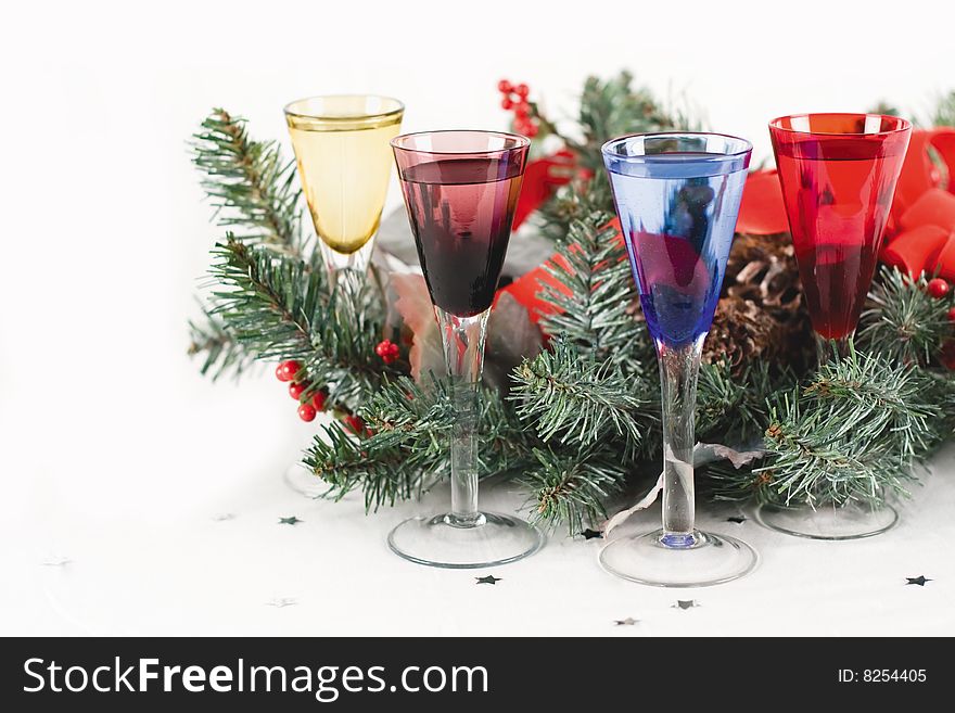 Four Festive Shot Glasses, Christmas bow, wreath, and two white ornaments. Four Festive Shot Glasses, Christmas bow, wreath, and two white ornaments.