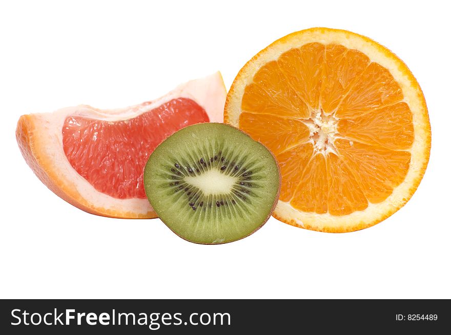 Ripe,juice segments of kiwi,orange and grapefruit isolated on a white background. Ripe,juice segments of kiwi,orange and grapefruit isolated on a white background.