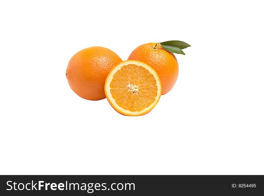 Juicy oranges with green leaves  isolated on a white. Juicy oranges with green leaves  isolated on a white.