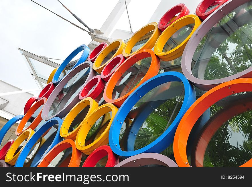Colorful circular rings on a glass wall