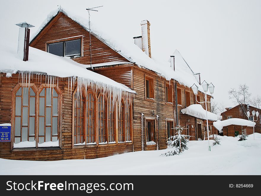 Big wooden house under snow. Big wooden house under snow