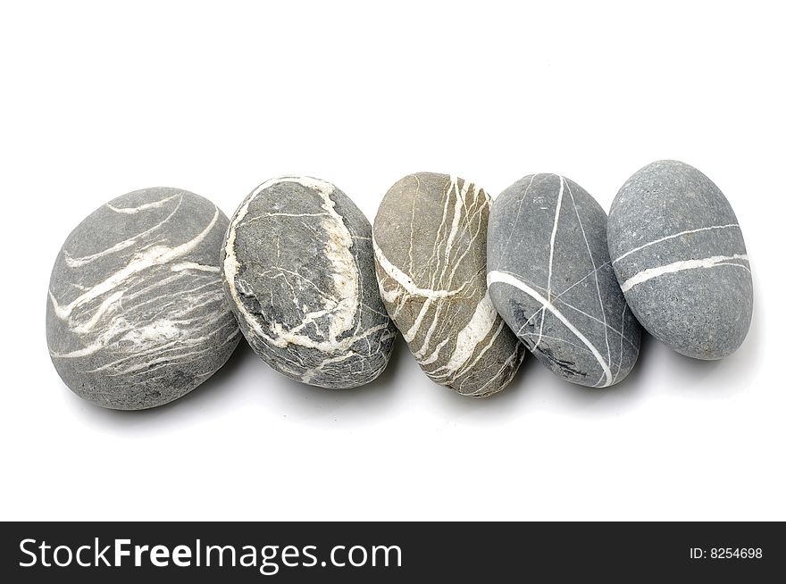 A row of stones on white