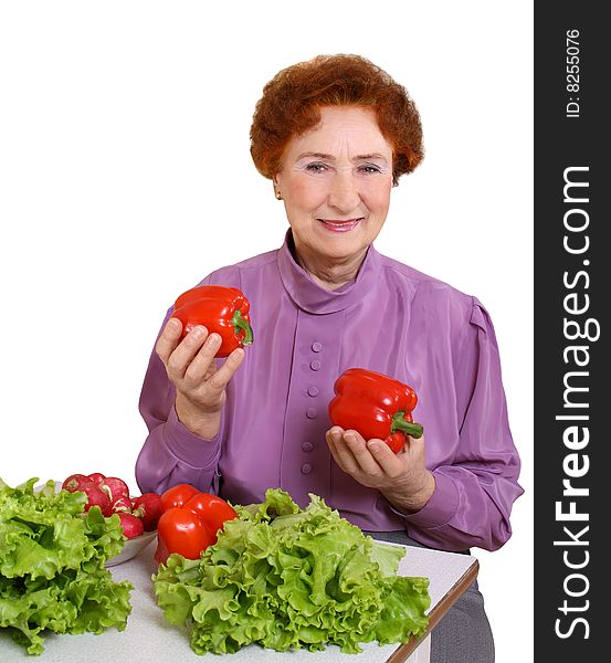 The woman with fresh vegetables on a white background. The woman with fresh vegetables on a white background