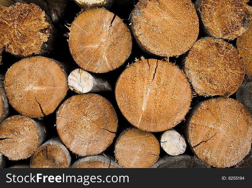 Stock photo: an image of a background of brown logs