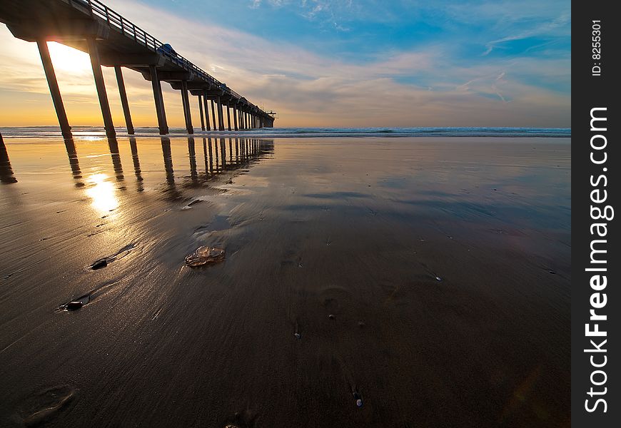 Sunset, Pier, And Jellyfish