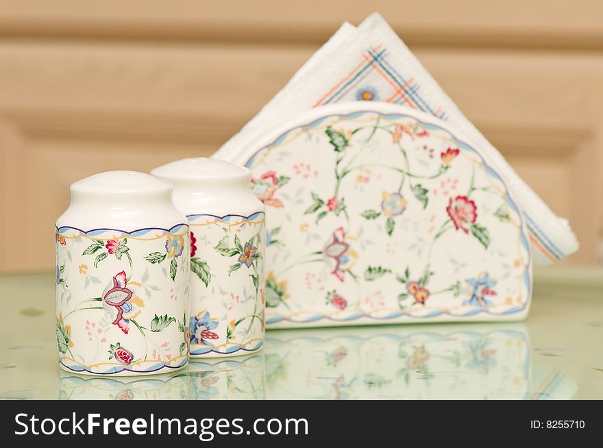 Salt & Pepper Shaker with paper napkins on the table