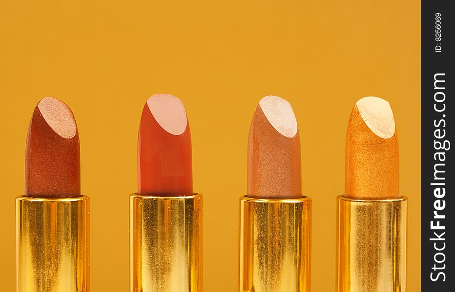 lipstick color samples on orange background. lipstick color samples on orange background