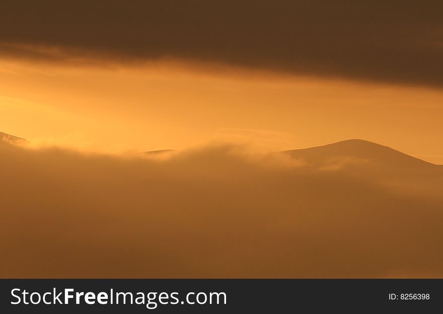 Beautiful orange sunset over the Malvern Hills, Worcestershire, England, UK. Beautiful orange sunset over the Malvern Hills, Worcestershire, England, UK