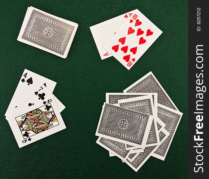 Playing cards on a green background