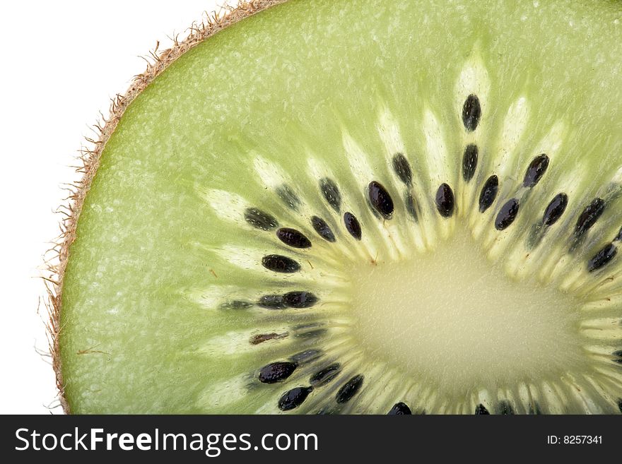 Slice of a fresh Kiwi Fruit - detailed macro view of section. Slice of a fresh Kiwi Fruit - detailed macro view of section