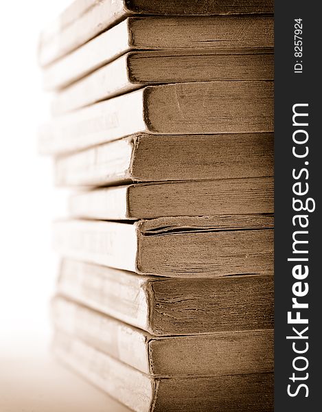 A stack of old books on white background