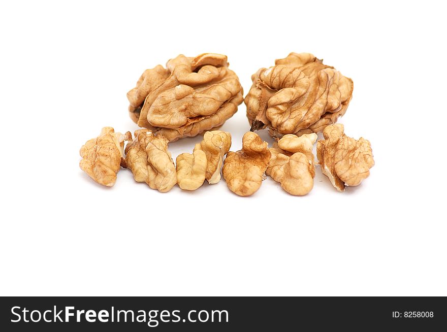 Wonderful pieces of walnuts  isolated on a  white background. Wonderful pieces of walnuts  isolated on a  white background.