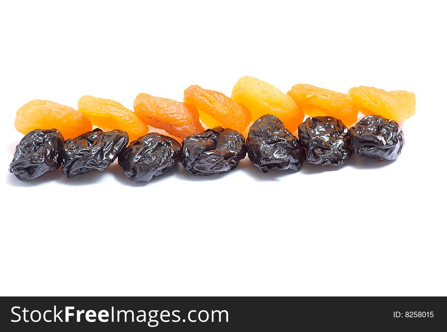 Dried apricot and prune  isolated on a white background. Dried apricot and prune  isolated on a white background.