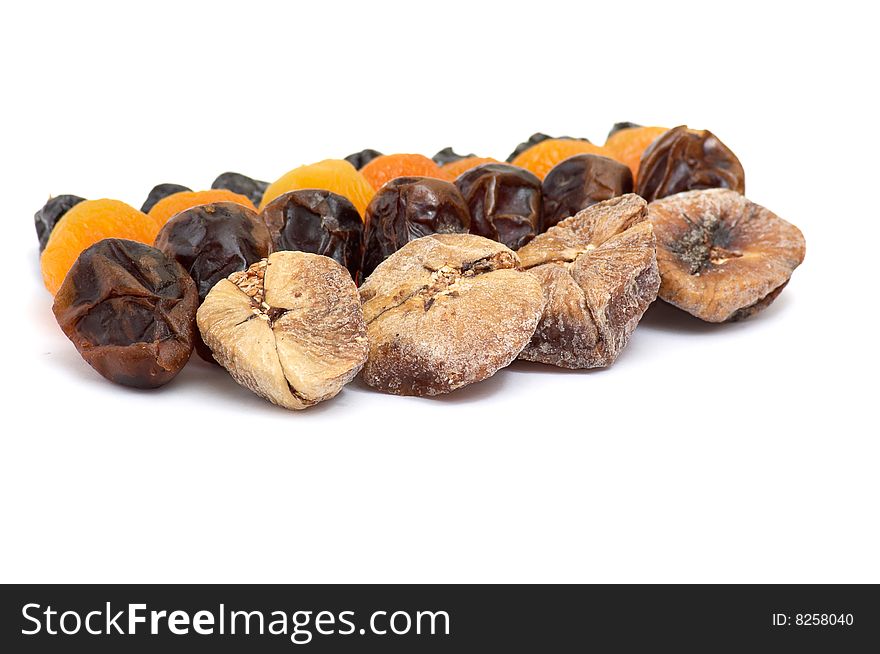 Different mixed dried fruits isolated on a white background. Different mixed dried fruits isolated on a white background.