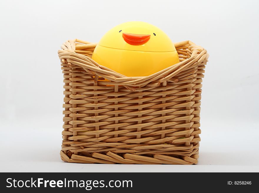 A plastic chicken cup and cane box.