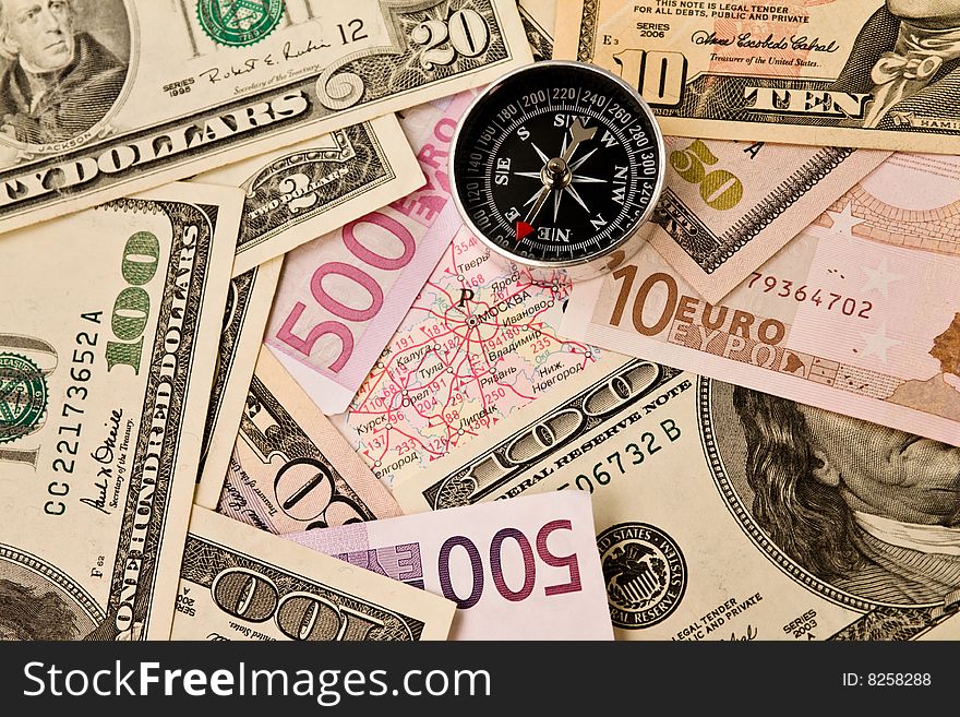Background from dollars, euro and compass. Background from dollars, euro and compass