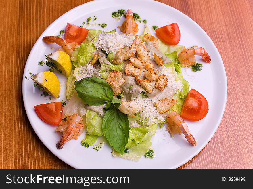 Salad Caesar with seafood and vegetables