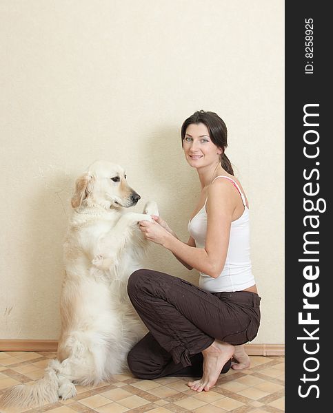 Girl plays with her dog labrador. Girl plays with her dog labrador