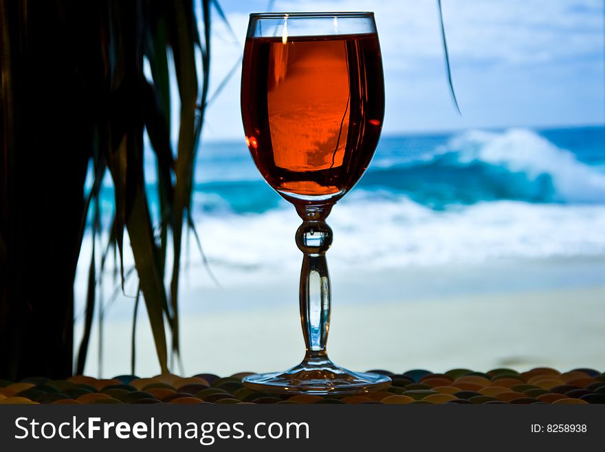 Glass of wine against the sea