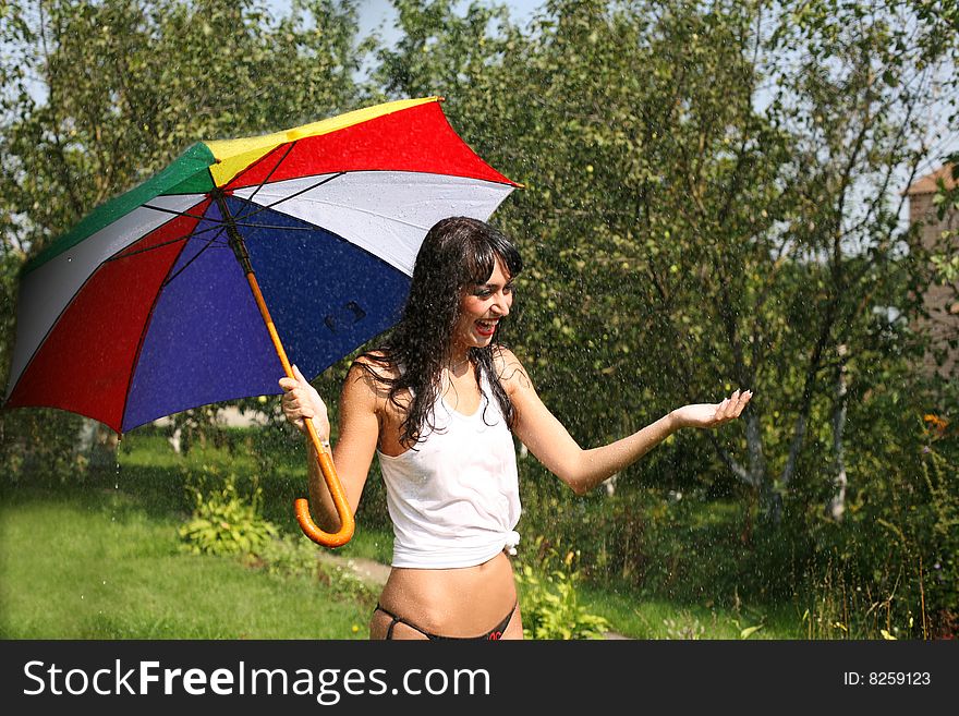 Girl under umbrella in rain
