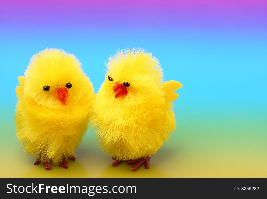 Easter chickens on colorful background