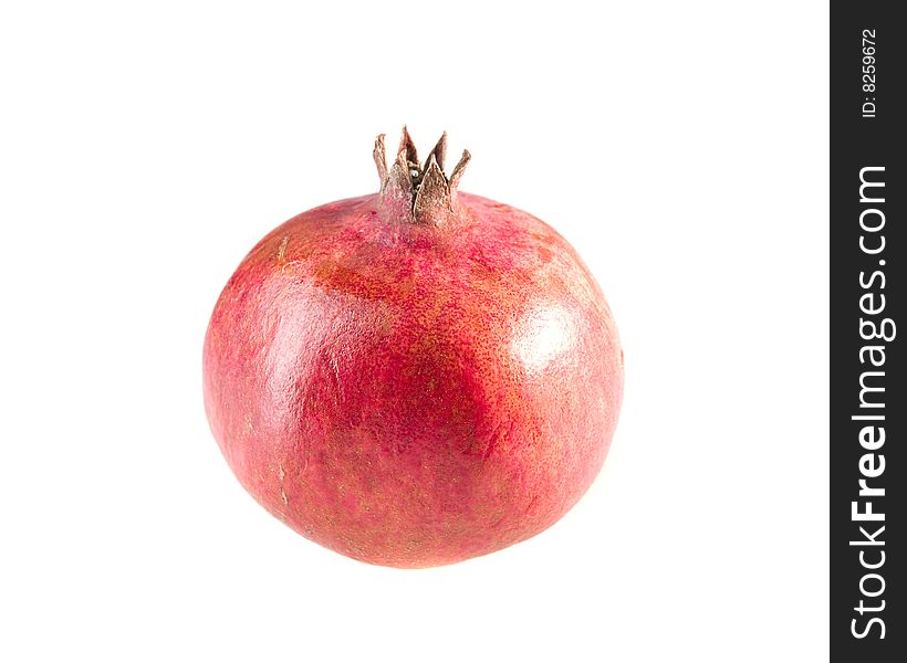 Ripe pomegranate on white ground