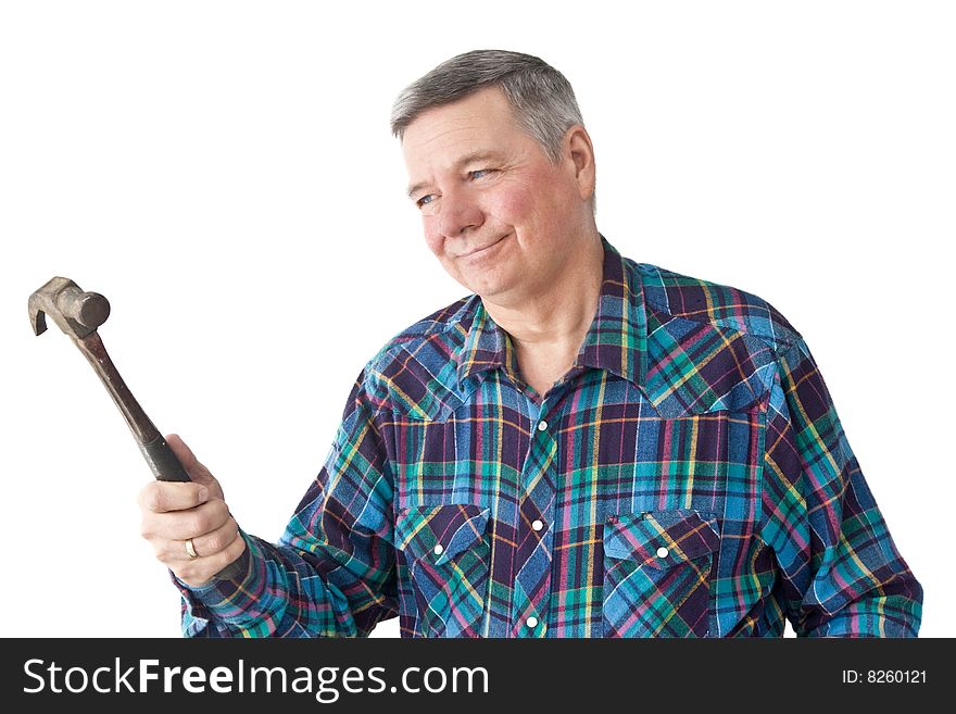 Mature Handyman admiring the hammer he is holding, isolated on a white background. Mature Handyman admiring the hammer he is holding, isolated on a white background.