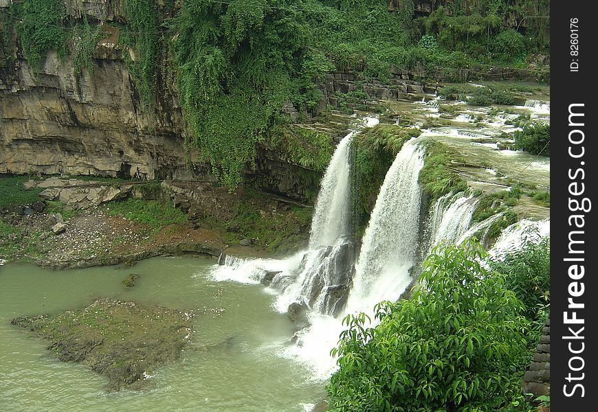 Summer river waterfalls formed together