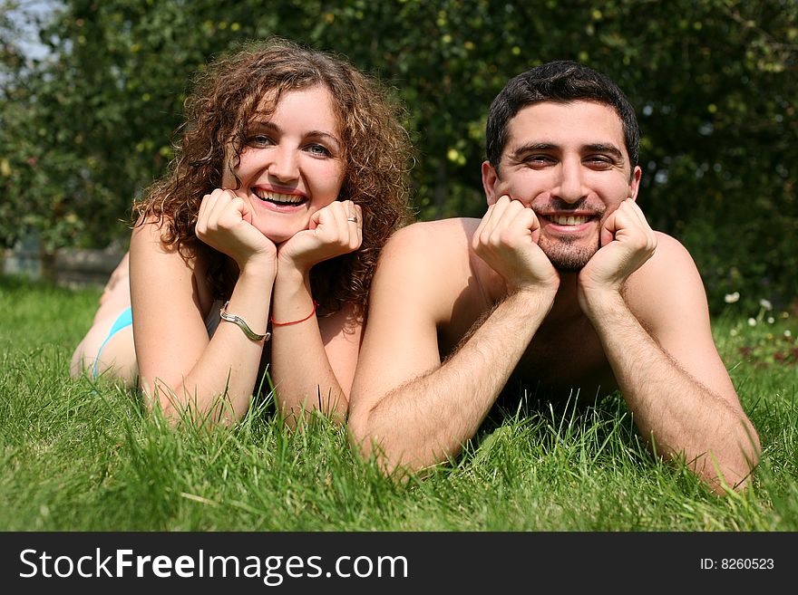 Romantic couple outdoors in green grass