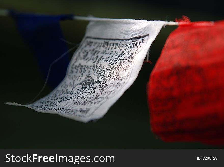 Tibetan prayer flags hanging outside.