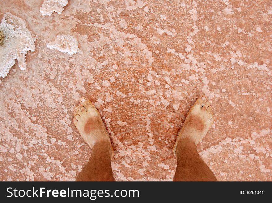 Legs in salt lake, Salinas - Pedra de Lume, Island Sal, Cape Verde. Legs in salt lake, Salinas - Pedra de Lume, Island Sal, Cape Verde.