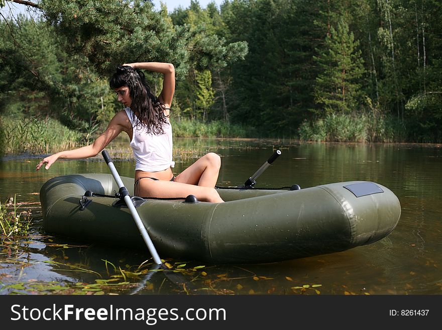 Lovely girl in boat in summertime