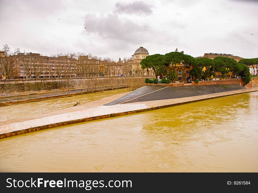 View across the River Tiber to Isola Tiberina in Rome. The island was modeled to resemble a ship by the romans in the 2nd century BC. View across the River Tiber to Isola Tiberina in Rome. The island was modeled to resemble a ship by the romans in the 2nd century BC