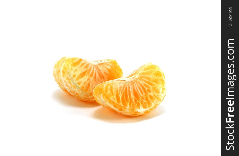 Orange segments of a tangerine isolated on a white background