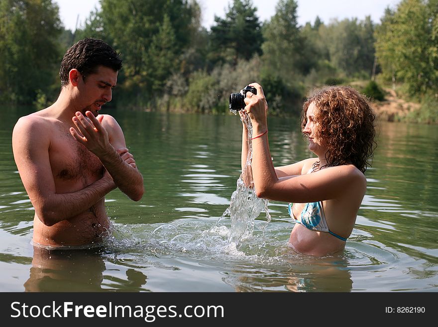 Girl make photo in water